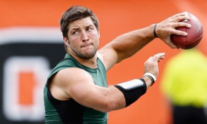 New York Jets quarterback Tim Tebow warms up before a preseason NFL game against the Cincinnati Bengals Aug. 1.