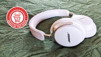 A picture of the Bose QuietComfort Ultra Headphones (2nd gen) on a green background with the deals of the week logo overlaid