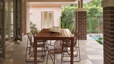 an outdoor dining setting on a checkered floor