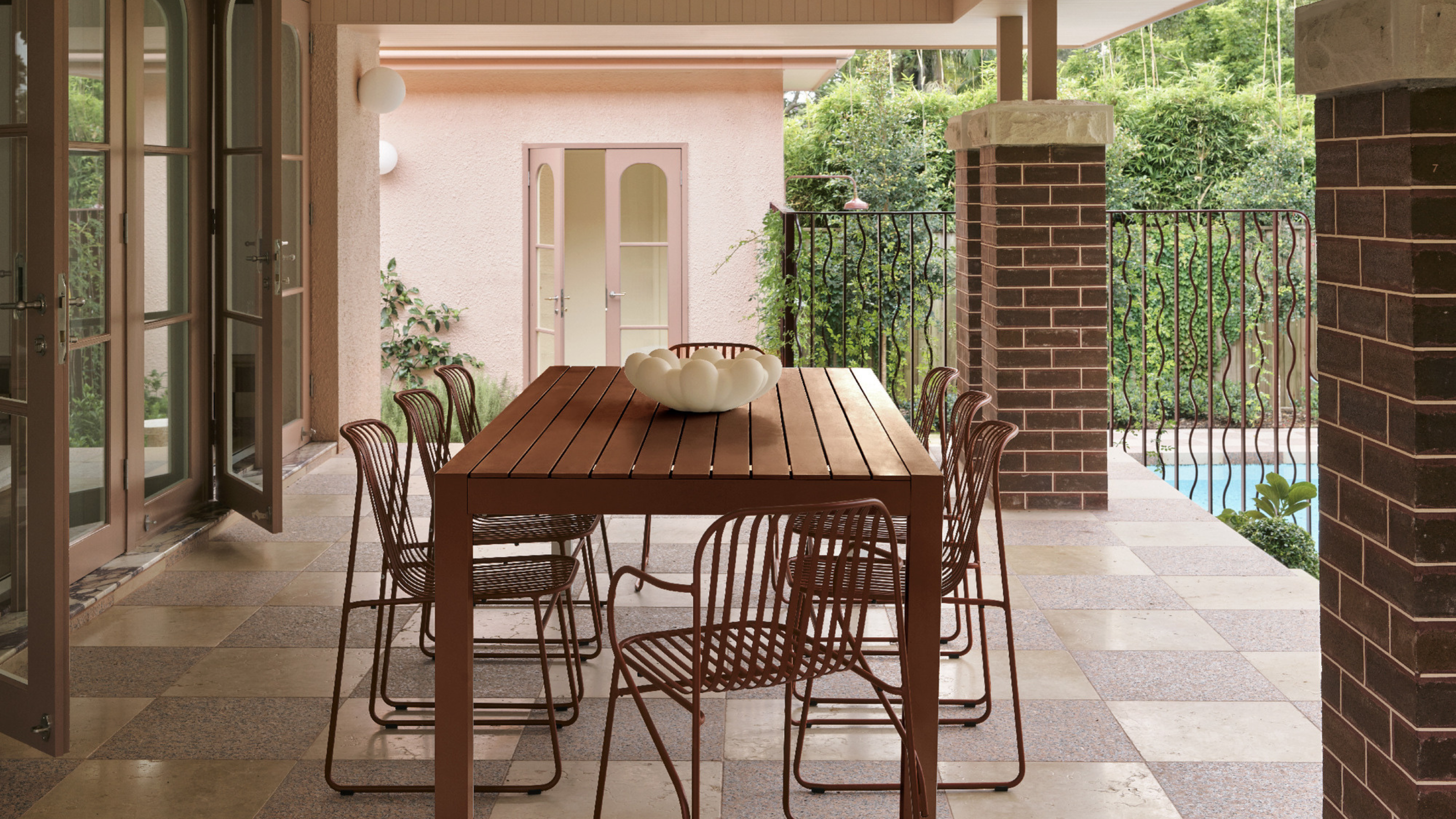 an outdoor dining setting on a checkered floor