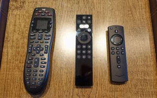 Harmony remote (left), Caavo (center) and Fire TV remote (right).
