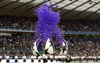 A giant football releases balloons ahead of the 2002 Champions League final between Real Madrid and Bayer Leverkusen at Glasgow's Hampden Park.