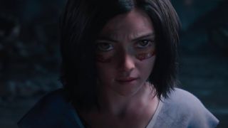 Rosa Salazar fiercely stares down an opponent in Alita: Battle Angel.