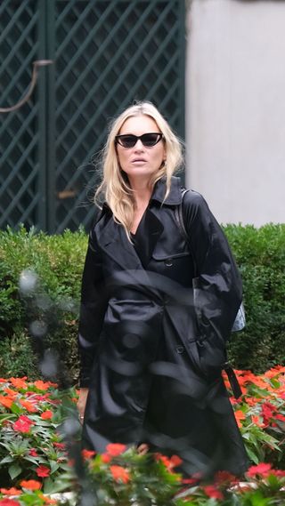 Kate Moss in black trench in Milan