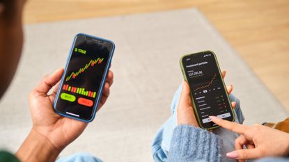 two people investing on their smartphones