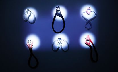 Six illuminated items against a dark backdrop. 