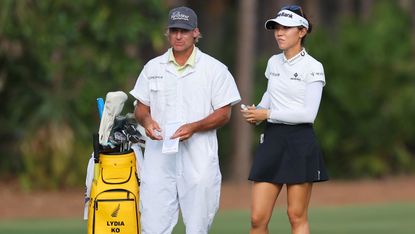 Lydia Ko and her caddie in discussion