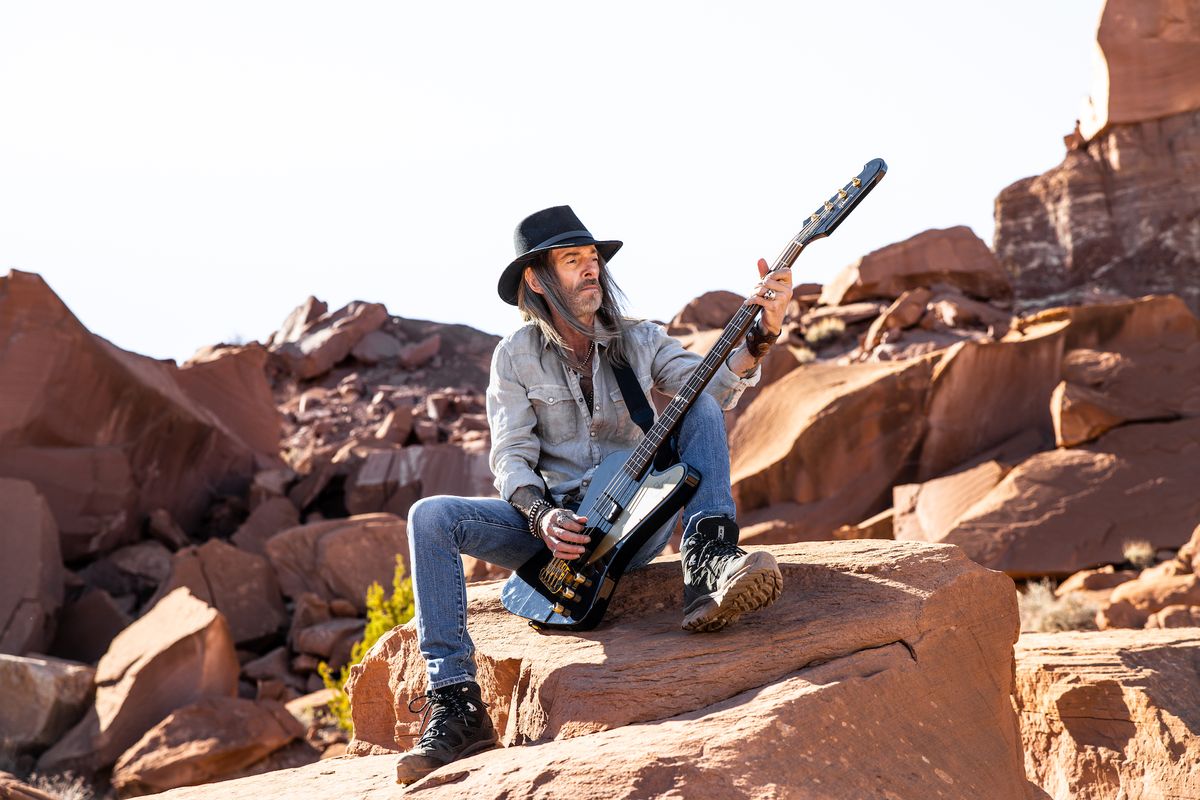 Rex Brown holds his new signature Gibson Thunderbird bass