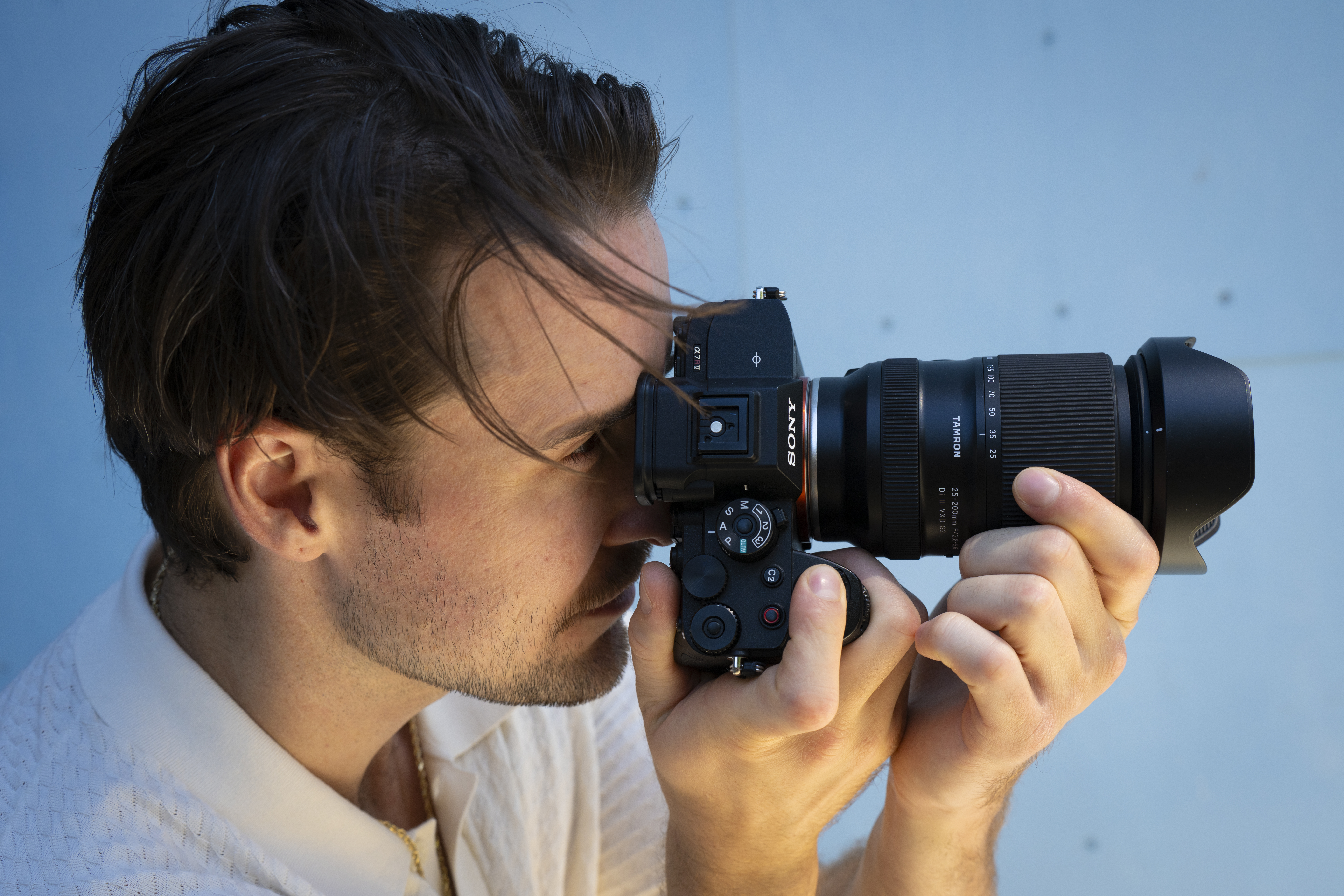 A person shooting with the Tamron 25-200mm f/2.8-5.6 DI III VXD G2