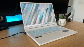 Acer Nitro V 14 gaming laptop on a wooden desk