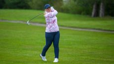 Carly Cummins hitting an iron shot