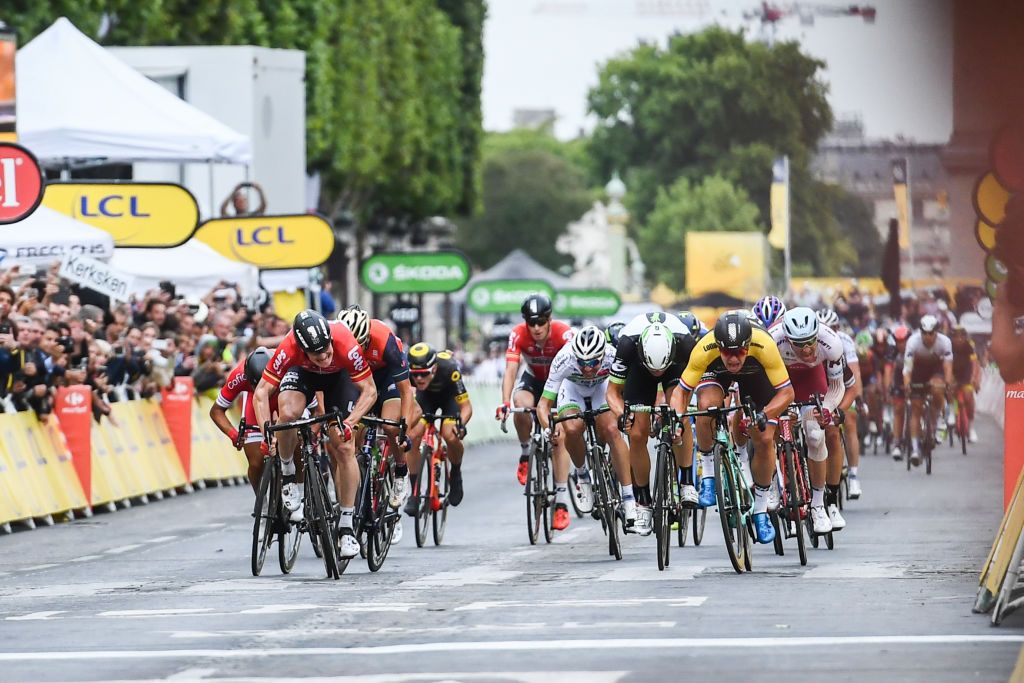 Dylan Groenewegen sprints to victory on the final stage of the Tour de France.