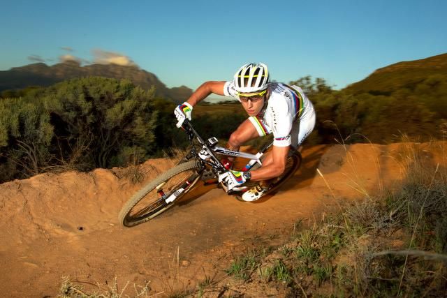 Cross Country World Champion, Nino Schurter, of the Scott Swisspower team sweeps through turn.