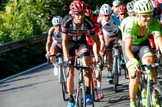 Warren Barguil climbs in the bunch during Milano-Torino