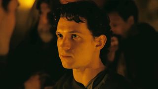 Tom Holland looking into the eyes of Robert Pattinson's character.