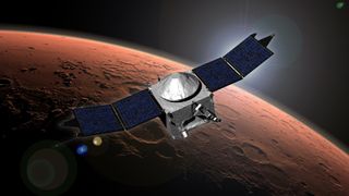 This image shows an artist concept of NASA's Mars Atmosphere and Volatile EvolutioN (MAVEN) spacecraft in orbit around the Red Planet. The Mars atmosphere probe will arrive at the planet on Sept. 21, 2014.