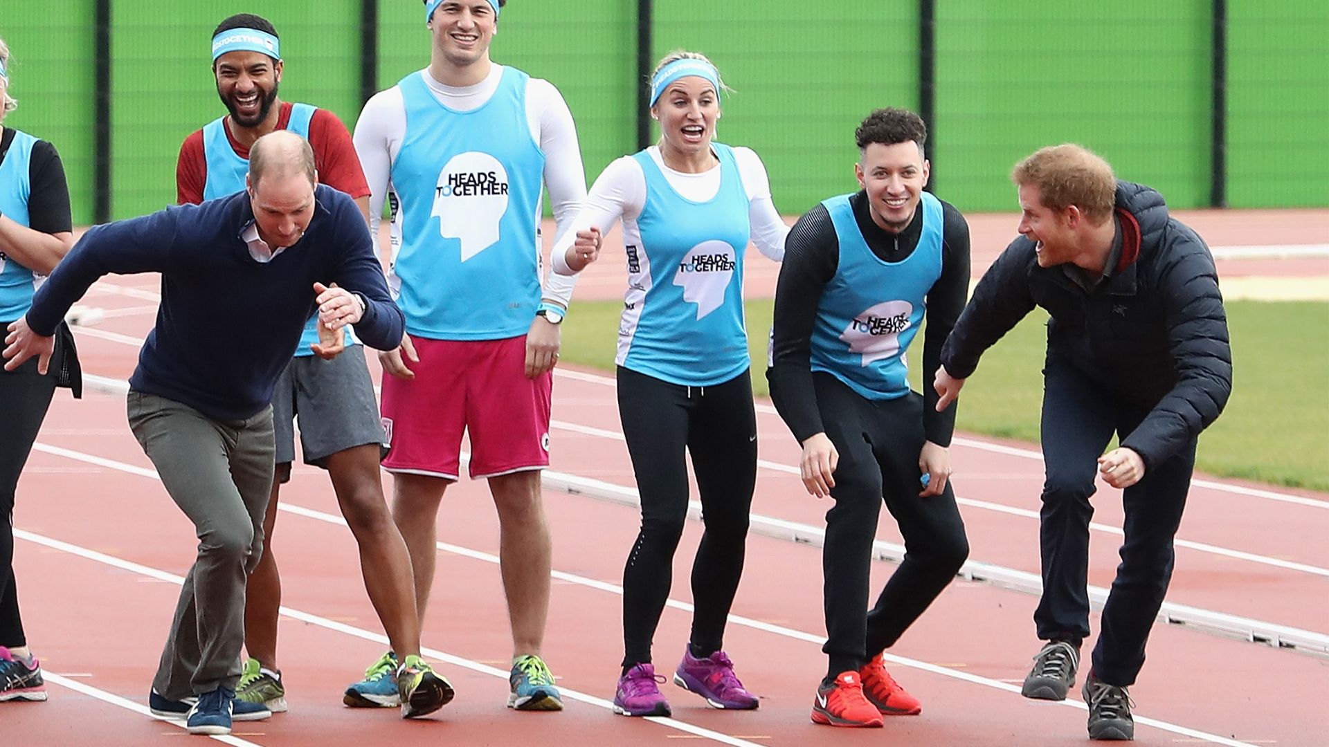 Prince William and Prince Harry take part in a charity run with other joggers