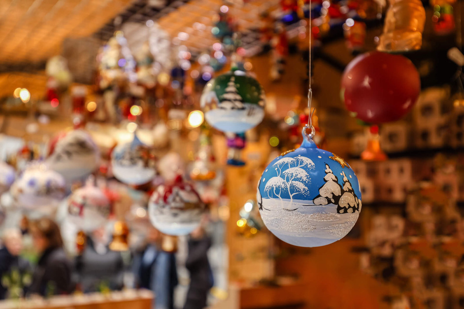 Hand painted Christmas baubles are displayed at a Christmas market