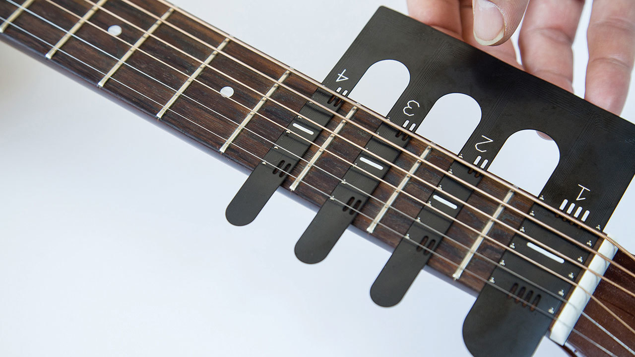 A picture of a guitar fret gizmo