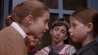 Charlotte Sullivan and Michelle Trachtenberg face off while Dov Tiefenbach watches in Harriet the Spy.