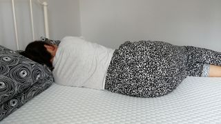 Lola Cool Hybrid mattress with primary reviewer lying on it