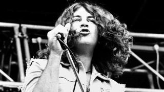 Ian Gillan performing onstage with Gillan in 1979