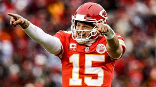 Patrick Mahomes of the Kansas City Chiefs points to the sidelines in celebration after throwing a touchdown in the lead up to Super Bowl LVIII