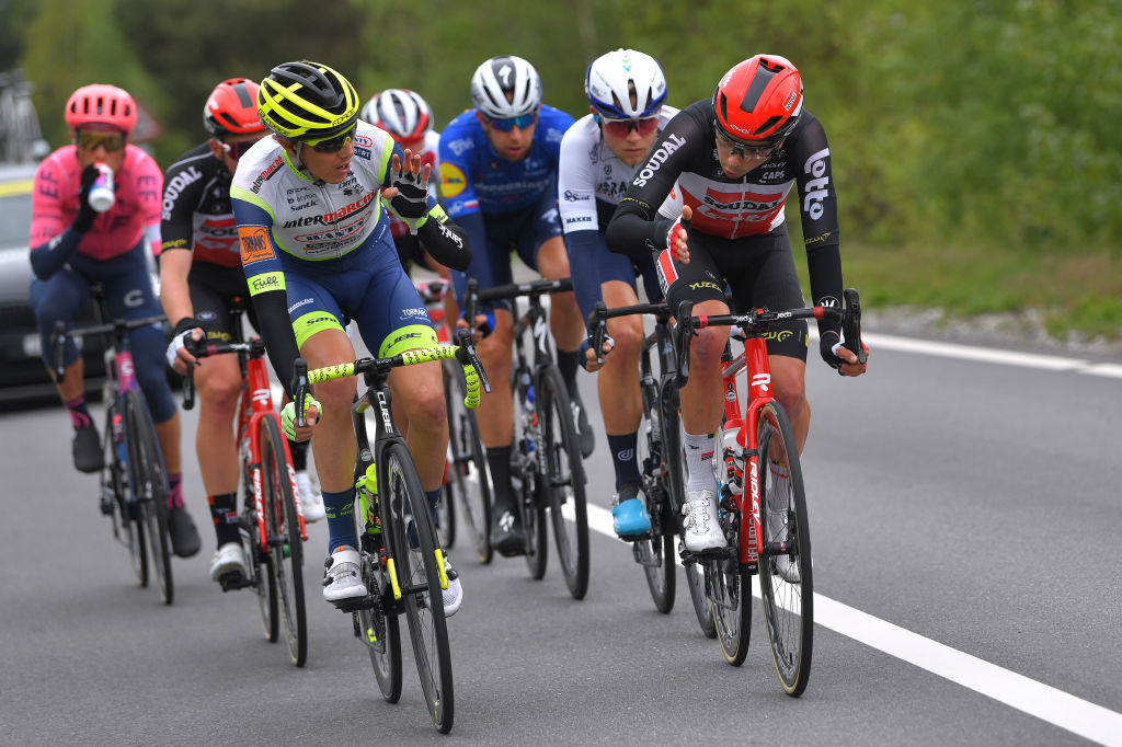 THYON 2000 LES COLLONS SWITZERLAND MAY 01 Simone Petilli of Italy and Team Intermarch Wanty Gobert Matriaux Kobe Goossens of Belgium and Team Lotto Soudal decide who heads the Breakaway during the 74th Tour De Romandie 2021 Stage 4 a 1613km stage from Sion to Thyon 2000 Les Collons 2076m TDR2021 TDRnonstop UCIworldtour on May 01 2021 in Thyon 2000 Les Collons Switzerland Photo by Luc ClaessenGetty Images