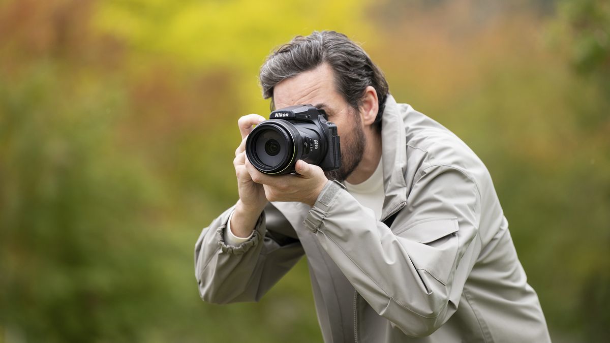 Nikon Coolpix P1100 superzoom camera in the hand