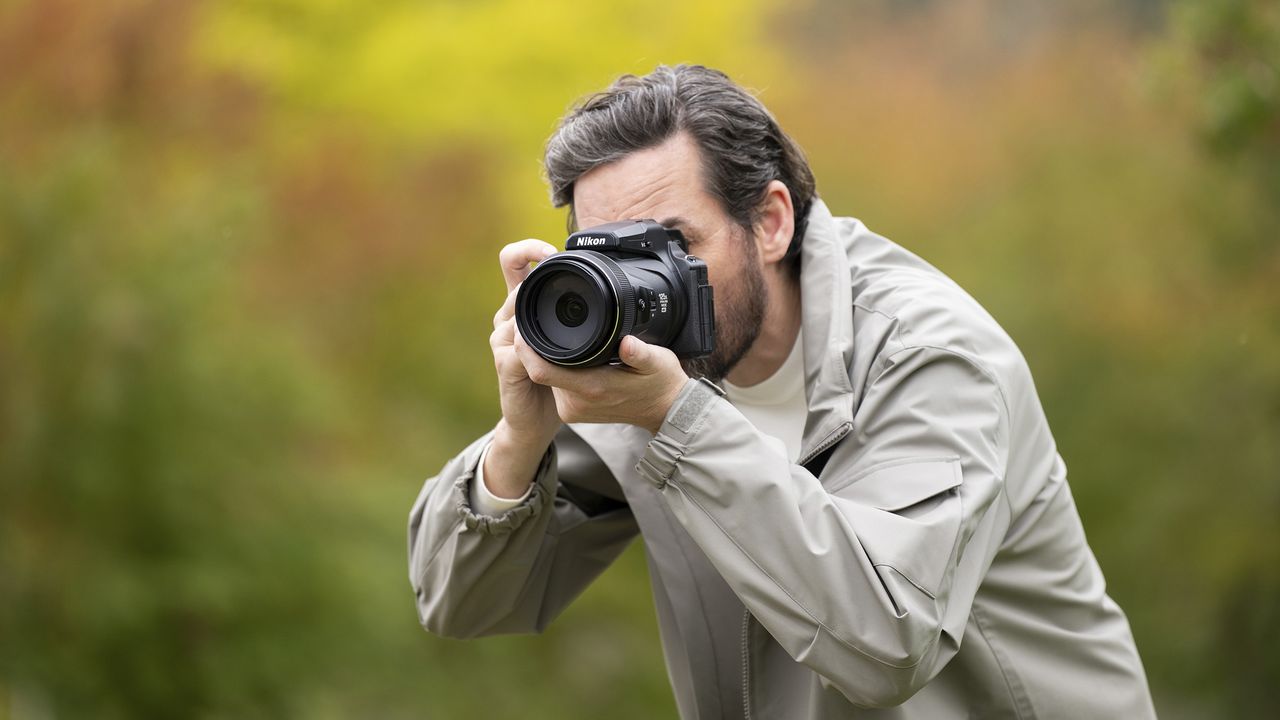 Nikon Coolpix P1100 superzoom camera in the hand