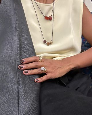 Woman wearing engagement ring.