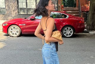 woman in black top and jeans