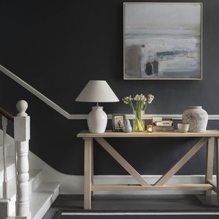 stairs with black wall lamp on wooden table