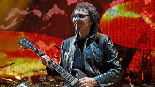 Tony Iommi performing onstage in 2016