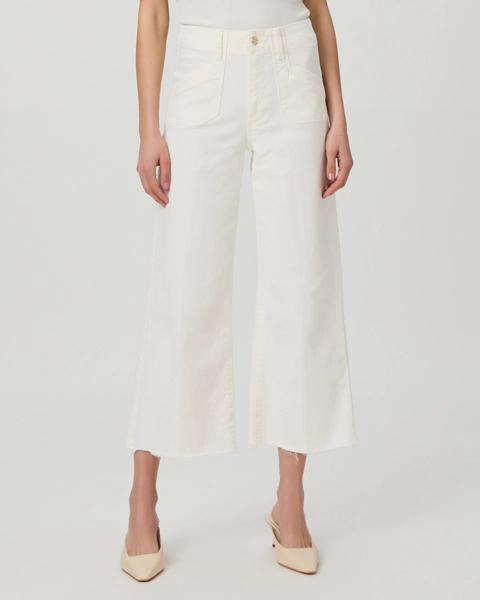 A model wearing white wide leg Paige jeans