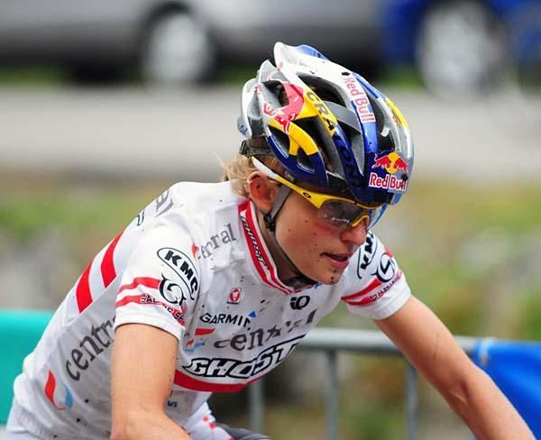 Elisabeth Osl (Central Ghost) leads with a half lap to go.