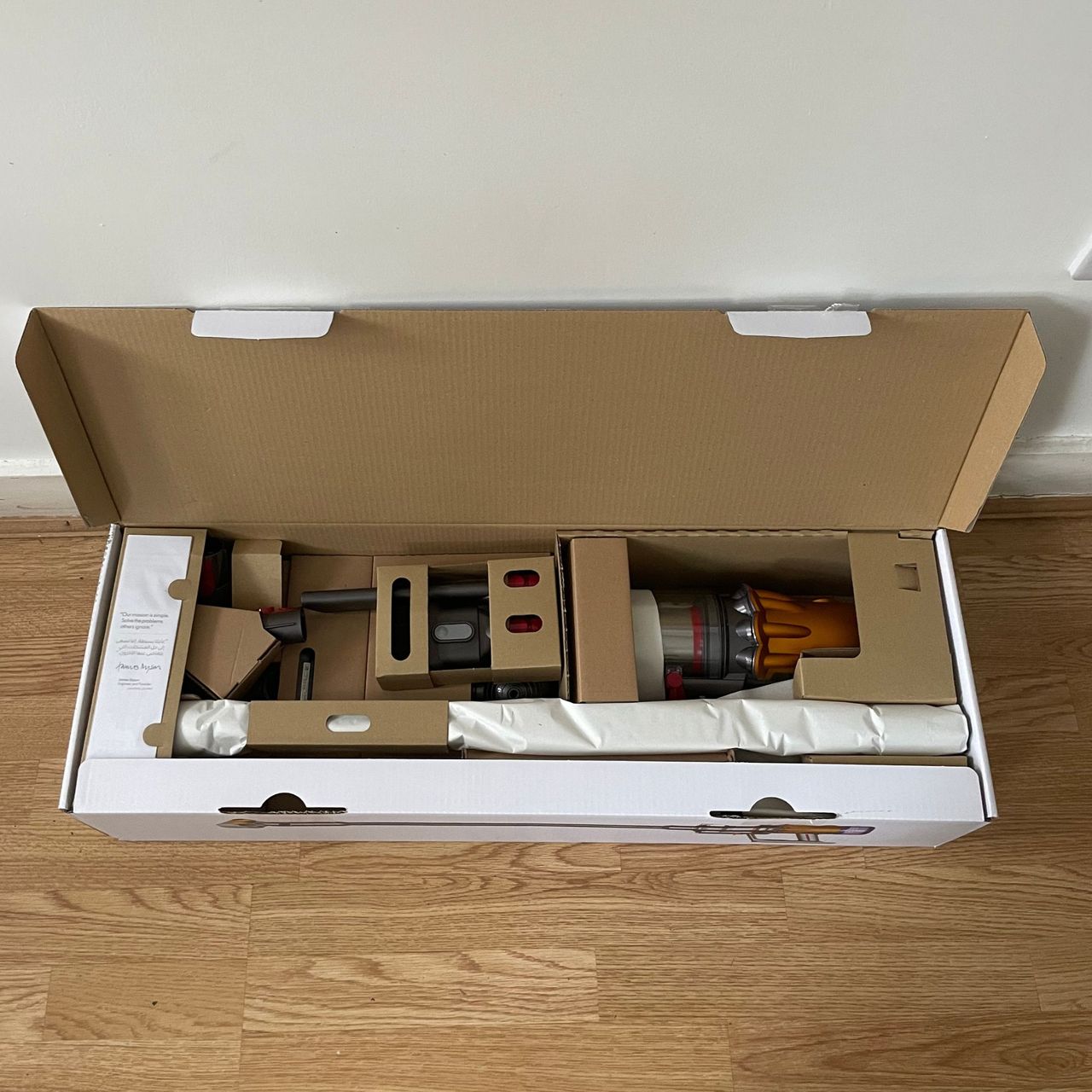 Unboxing the Dyson V12 Detect Slim Absolute on wooden floor