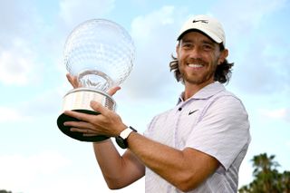 Tommy Fleetwood holding the Nedbank Golf Challenge trophy