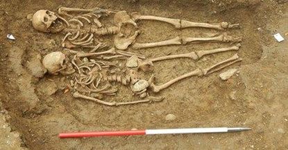 Skeletons unearthed in England found holding hands