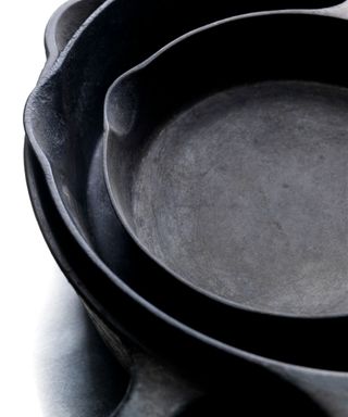A stack of cast iron pans