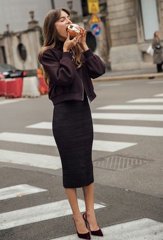 A Woman Wearing The Wine Red Color Trend During Milan Fashion Week Spring/Summer 2025.