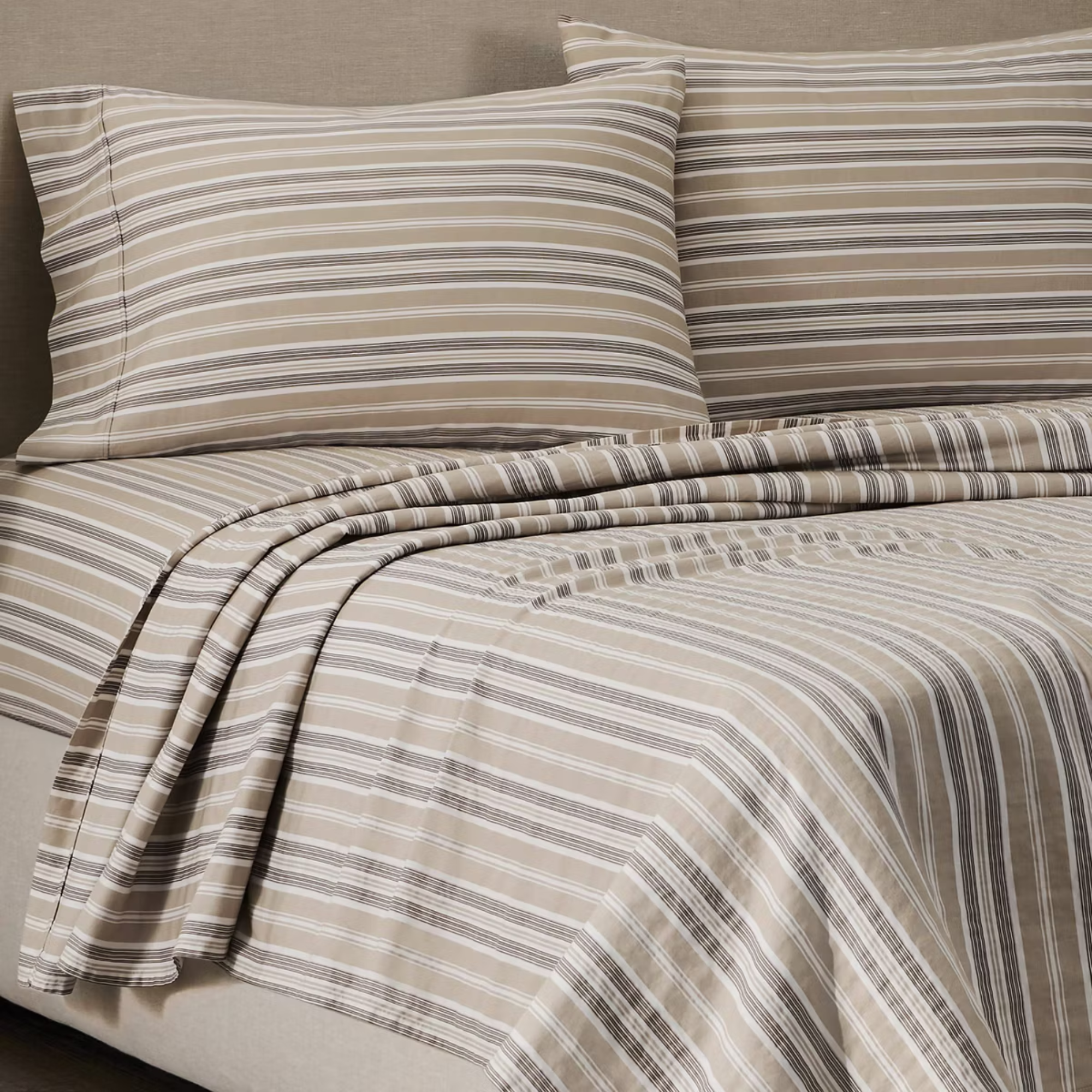 striped sheets on a bed