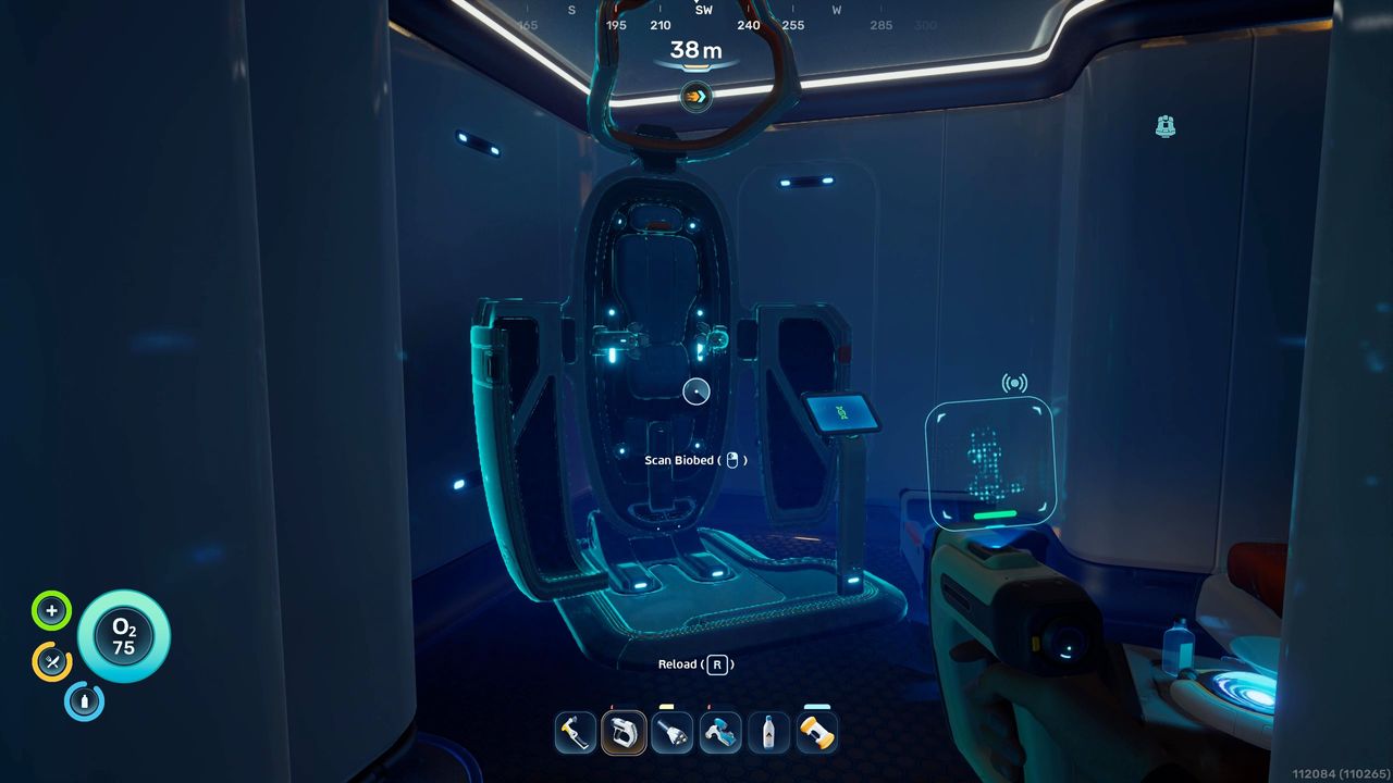 Subnautica 2 inventory size: A player looking at a Biobed inside a dark building, where you can get permanent inventory upgrades.