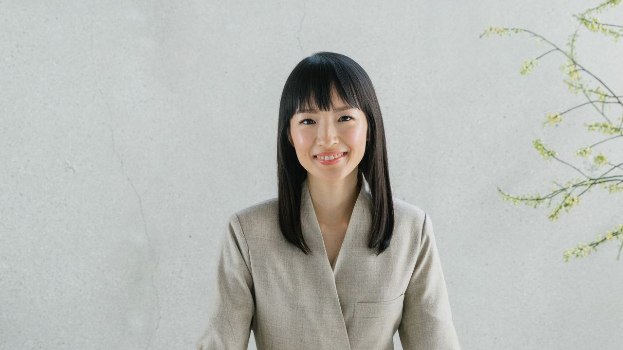 Marie Kondo on a gray background