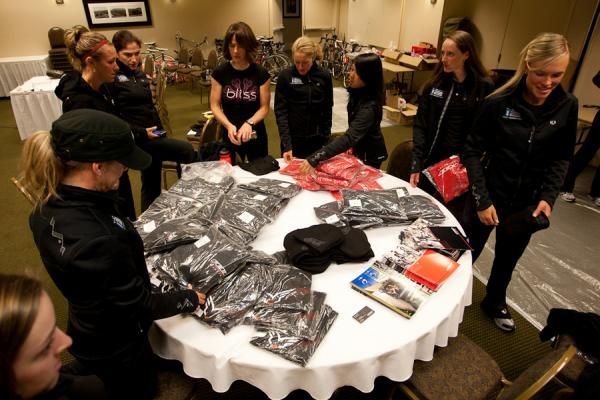 Riders gather for swag handout at team camp, this time from Felt Bicycles.