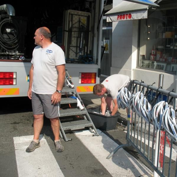 The mechanics are cleaning the riders' equipment
