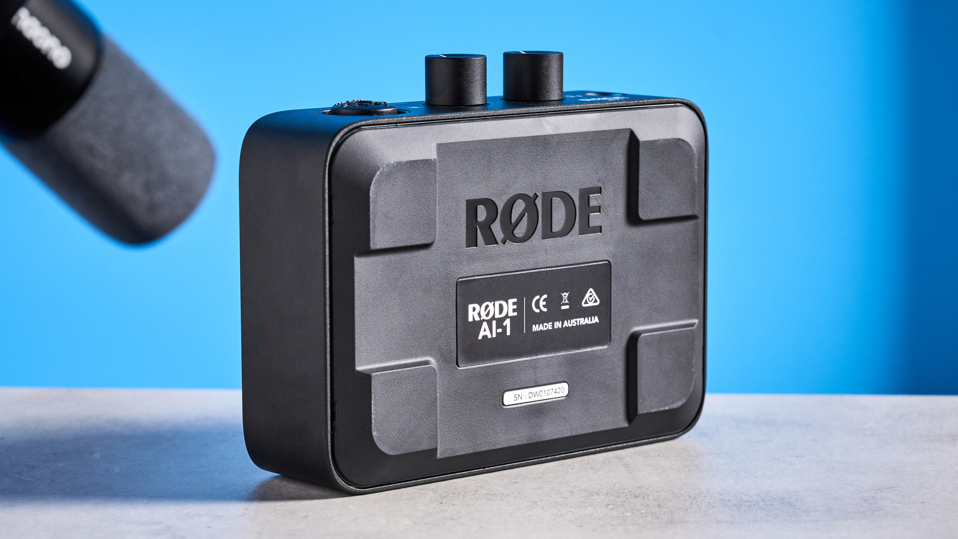 the rode ai-1 audio interface in black with an XLR input, a headphone input, and 2 speaker outputs