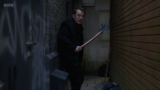 Ben Mitchell holding a weapon after attacking a man