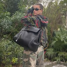 @haileybieber wearing oversized black chanel bag