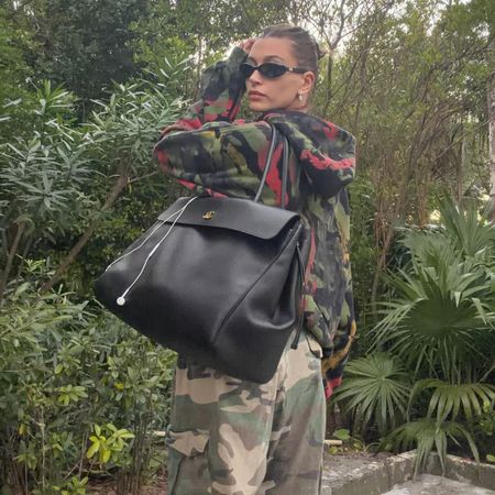 @haileybieber wearing oversized black chanel bag